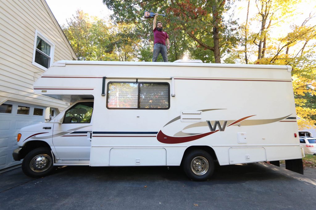 Ross Malcolm Boyd with ukulele on RV photo by Nat Ward | Outdoorsy