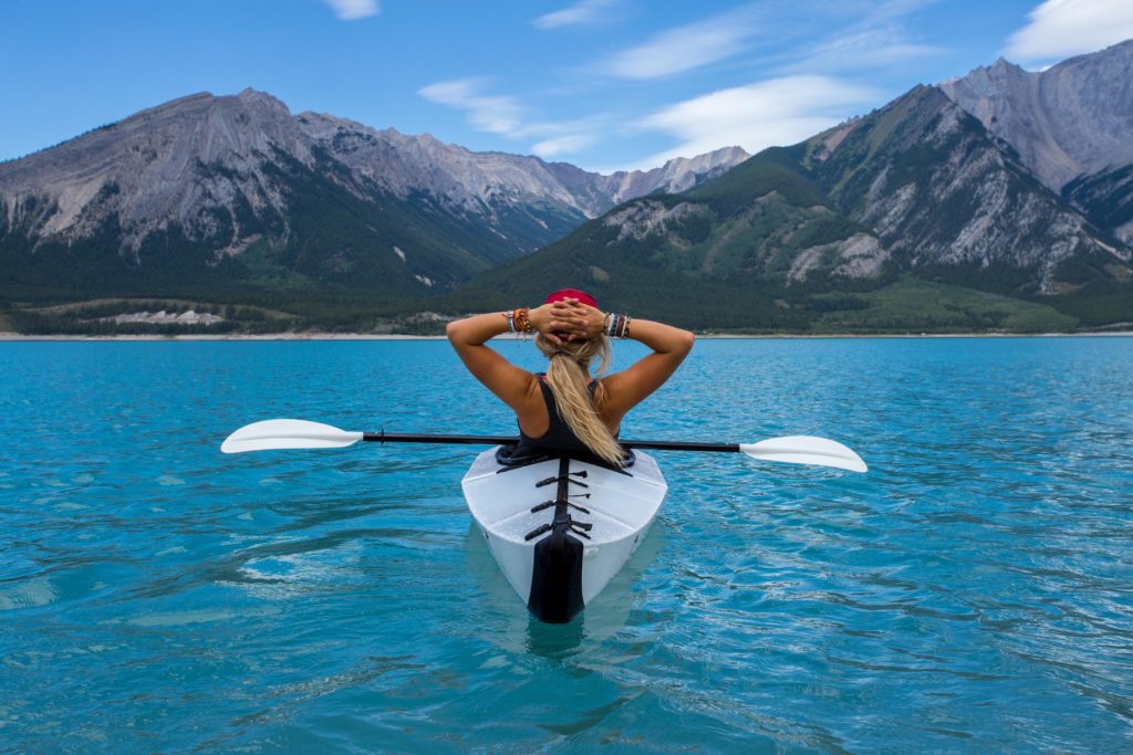 Kayak, water, and mountains