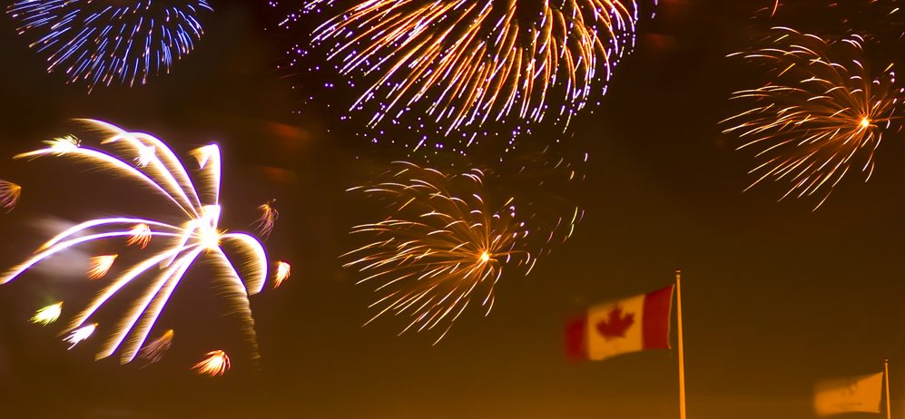 Canada Day fireworks. Canada day with a Canadian flag and a burst of fireworks