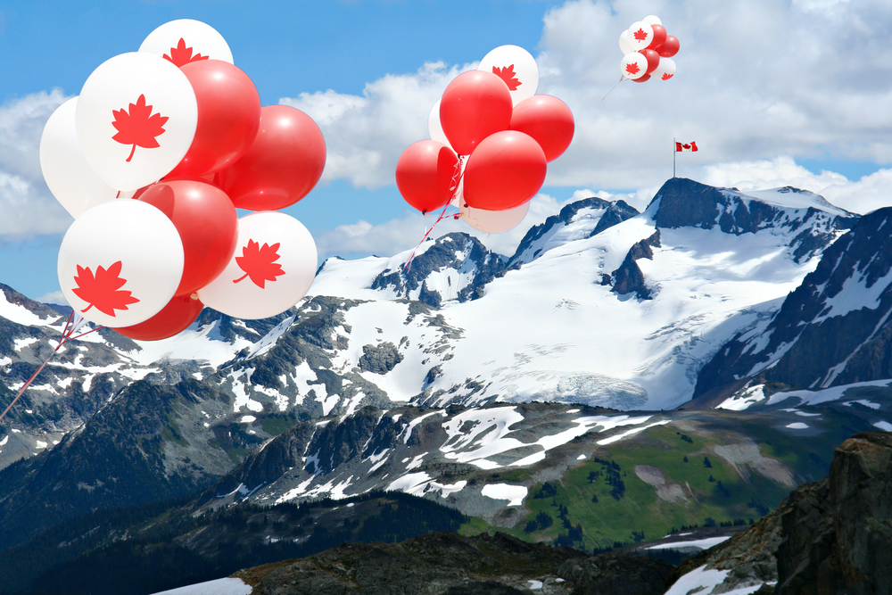 Rent an RV for Canada Day. Canadian Maple Leaf balloons float above Rocky Mountains